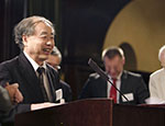 Makoto Kobayashi accepting a copy of the book